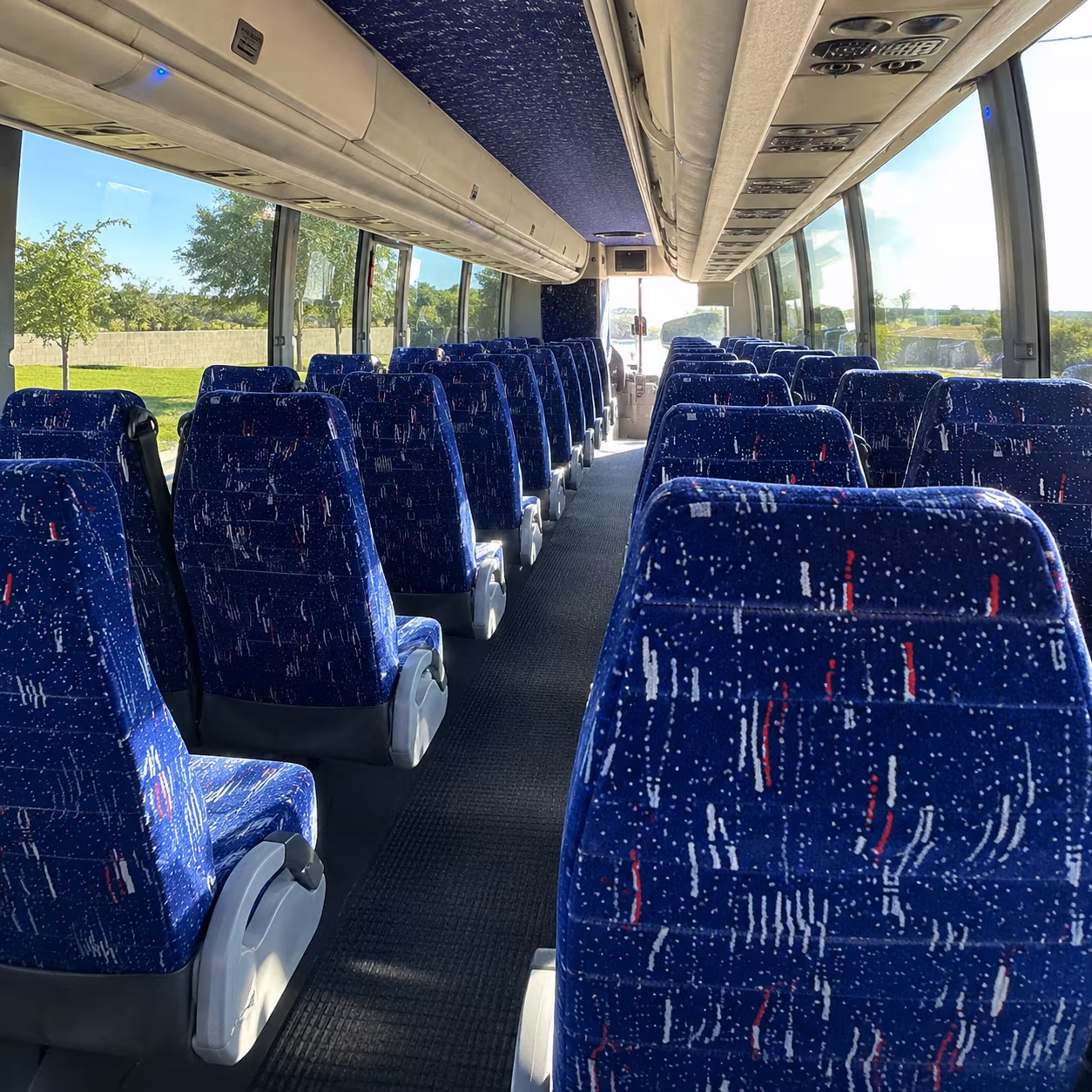 how one way transfers round trips and multi day bookings are priced for bus rentals in denton